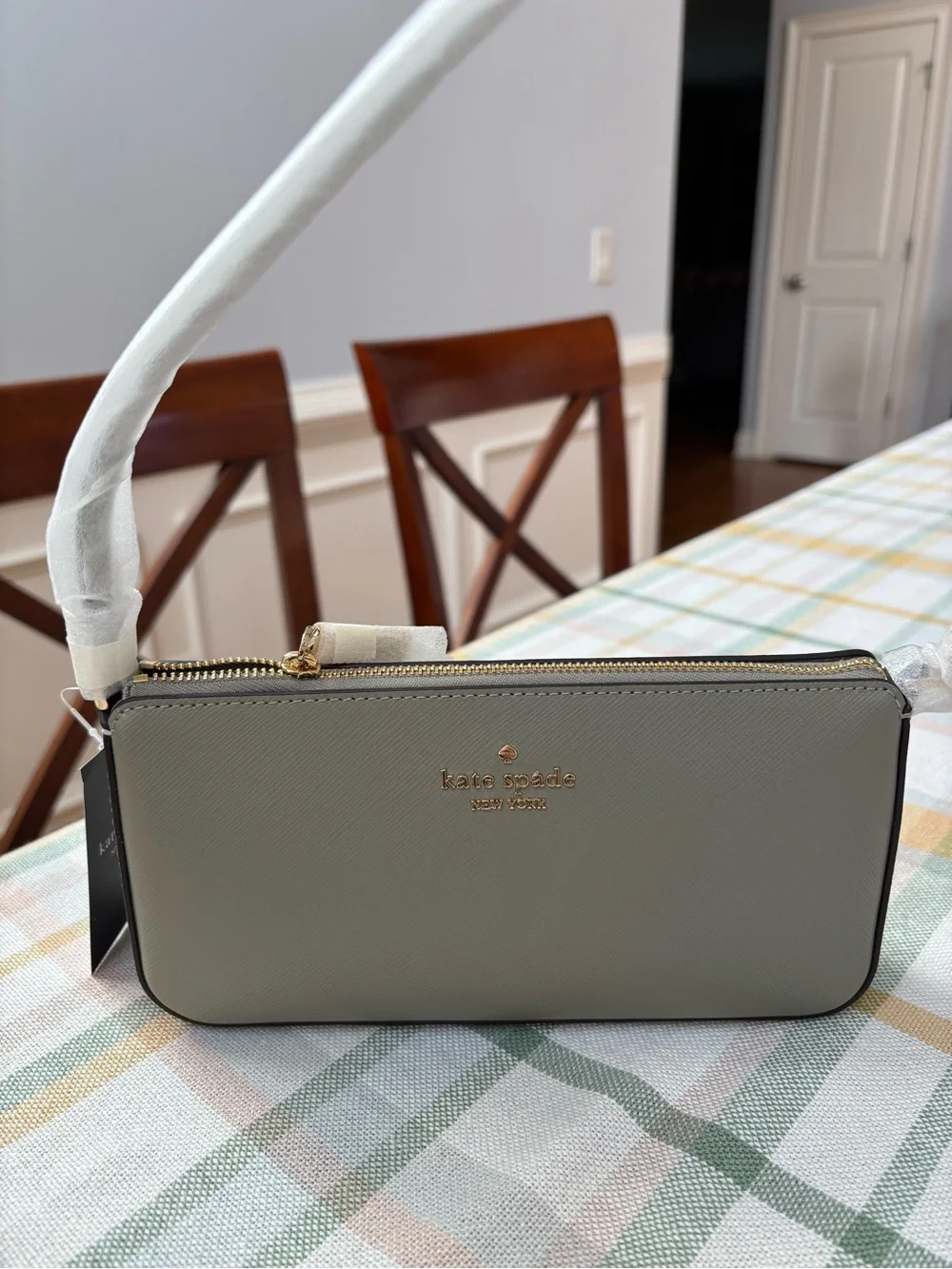 kate spade Gemini Mini Bag in taupe with black strap and gold hardware